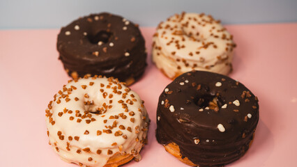 A vibrant selection of assorted donuts with various toppings and glazes, perfect for bakeries,...