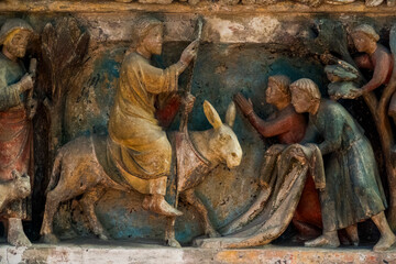 Naklejka premium Jesus enters Jerusalem on a donkey, welcomed with palm branches