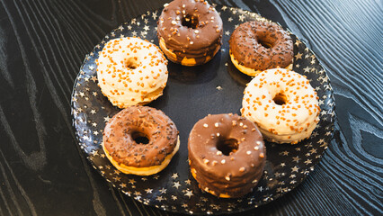 A vibrant selection of assorted donuts with various toppings and glazes, perfect for bakeries,...