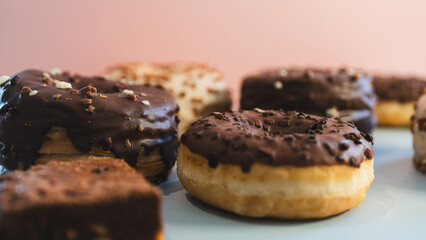 A vibrant selection of assorted donuts with various toppings and glazes, perfect for bakeries, cafés, or dessert promotions. Professional food photography with bright lighting