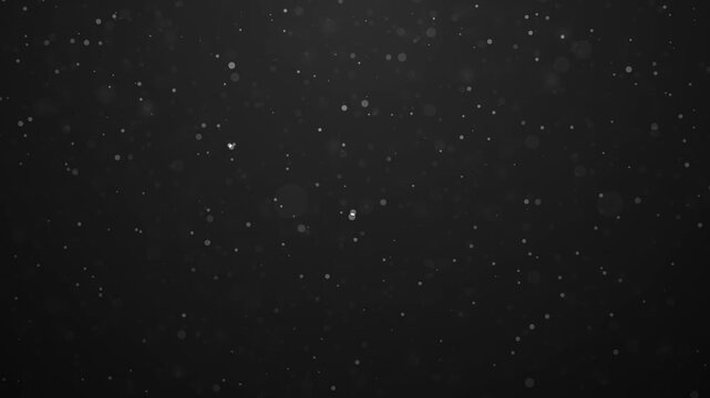 flying dust molecules on a black background