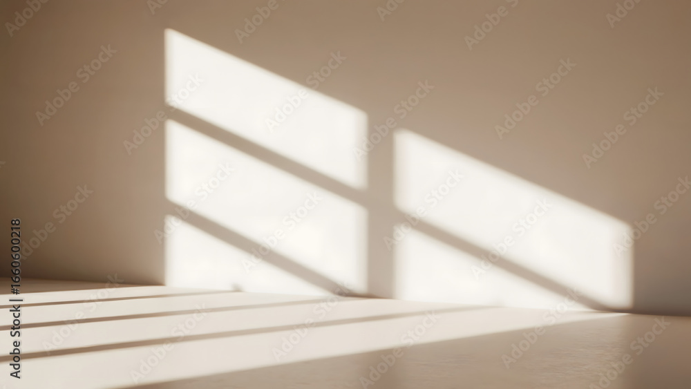 Poster sunlight casting shadows on a beige wall and floor creating a geometric pattern in an empty room