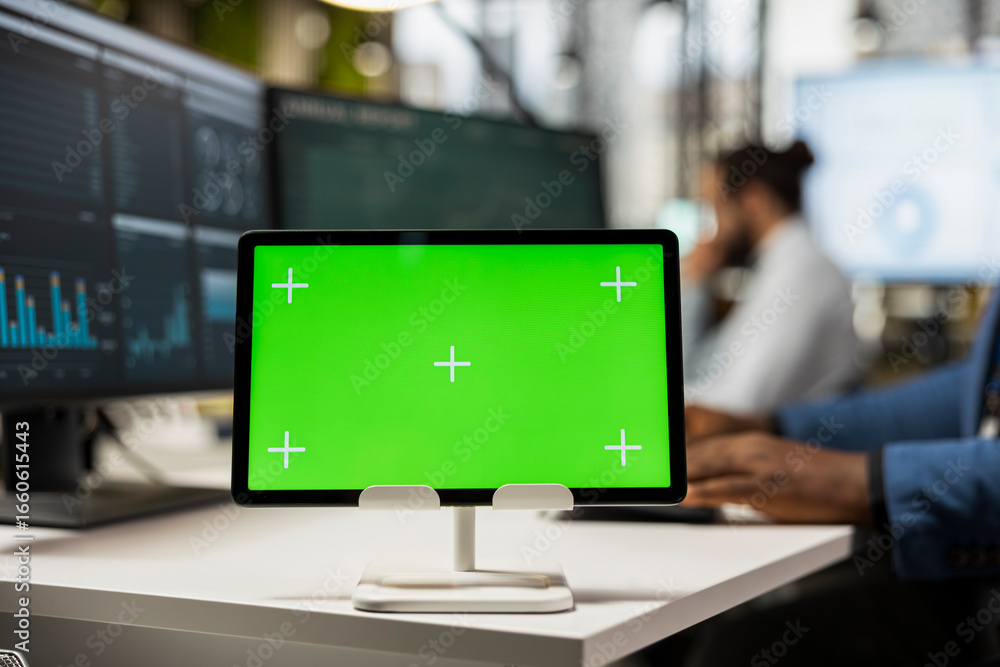 Poster close up of black businessman examines reports on graphs with chroma key on tablet, building a new b