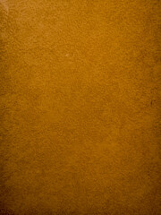 Fototapeta premium Textured orange paper background with subtle pattern