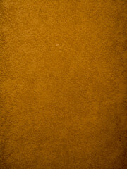 Brown textured wall surface with subtle rough pattern background
