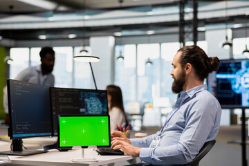 Engineer using isolated screen tablet to adjust machine learning algorithms parameters, automating workflow. Tech company employee using AI insights for code optimization on chroma key device