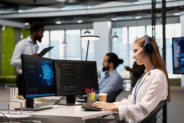 Smiling junior dev in tech startup utilizing AI to optimize performance while listening music....