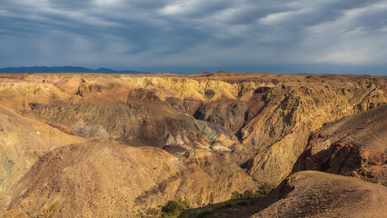 Striking Kazakhstan canyon scenery: towering red cliffs with intricate wind-sculpted patterns