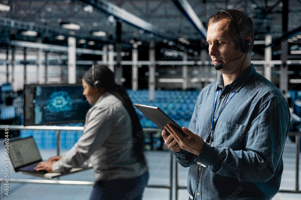 Poster data center admin wearing headset microphone providing remote diagnostics using tablet. technician m