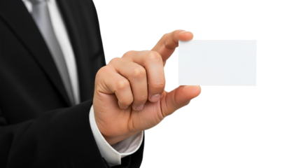 A man in a suit holding a blank white card between his fingers against a in a studio shot