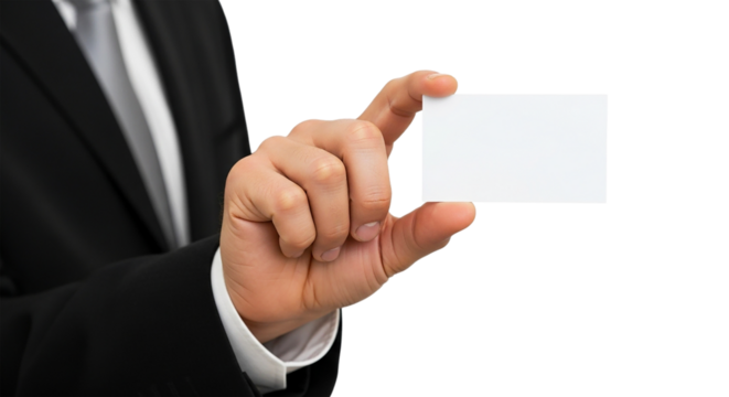 A man in a suit holding a blank white card between his fingers against a in a studio shot