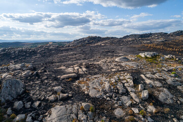 An Aerial View of a Burnt and Rocky Landscape. Concept The aftermath of a wildfire.