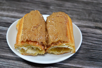 biscuit cream eclair cake stuffed with cream and made of butter, salt, flour, eggs, milk, whipping...