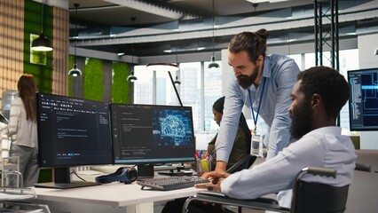 Startup engineer and colleague with paraplegia brainstorming, working with machine learning tech....