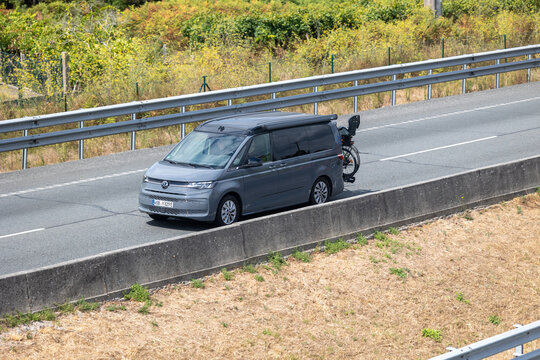 Pontevedra, spain 20 08 2025 volkswagen california t7 driving on the highway with bicycle on the back. Pontevedra, spain 20 08 2025