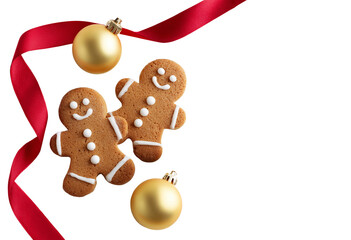 Top view of two decorated gingerbread cookies shaped as happy snowmen with golden baubles and red ribbon isolated transparent. Christmas concept
