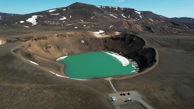 Iceland Krafla Viti Crater Aerial View with Turquoise Lake and Ice Floes 4K 60fps