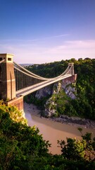 Elevated view of a suspension bridge over a river valley