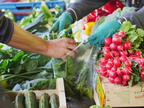 Man is buying vegetables from a market