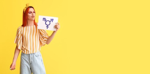Stylish transgender woman on yellow background with space for text