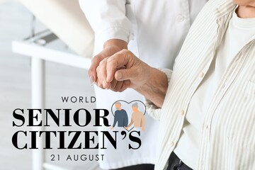 Female doctor with senior patient holding hands in clinic, closeup. Senior Citizen's Day