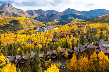 Mountain Village, Telluride Colorado with resort and condos among the golden autumn Aspen trees