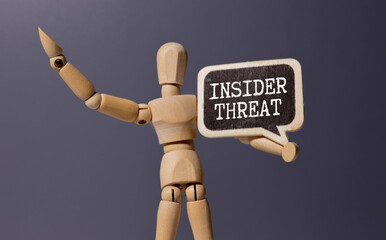 White card with the text INSIDER THREAT in a craft envelope