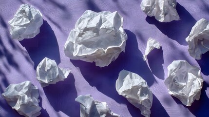 Crumpled White Tissues on Purple Surface with Shadows and Texture