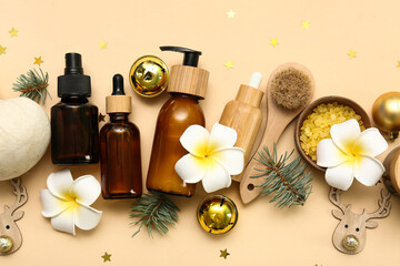 Composition with cosmetic products, spa accessories and Christmas decorations on color background