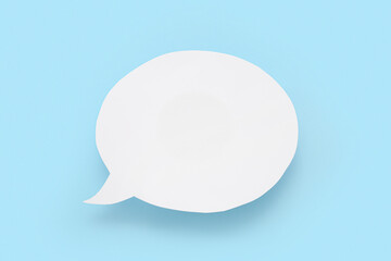 Empty paper speech bubble on blue background