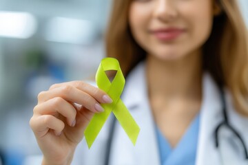 Female doctor showing lime green awareness ribbon, for lymphoma, depression, anxiety, childhood cancer, mitochondrial disease or other causes