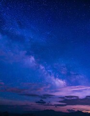 Naklejka premium Starry night sky with clouds