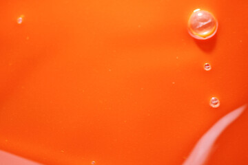 Mixture of orange and red color liquid as background
