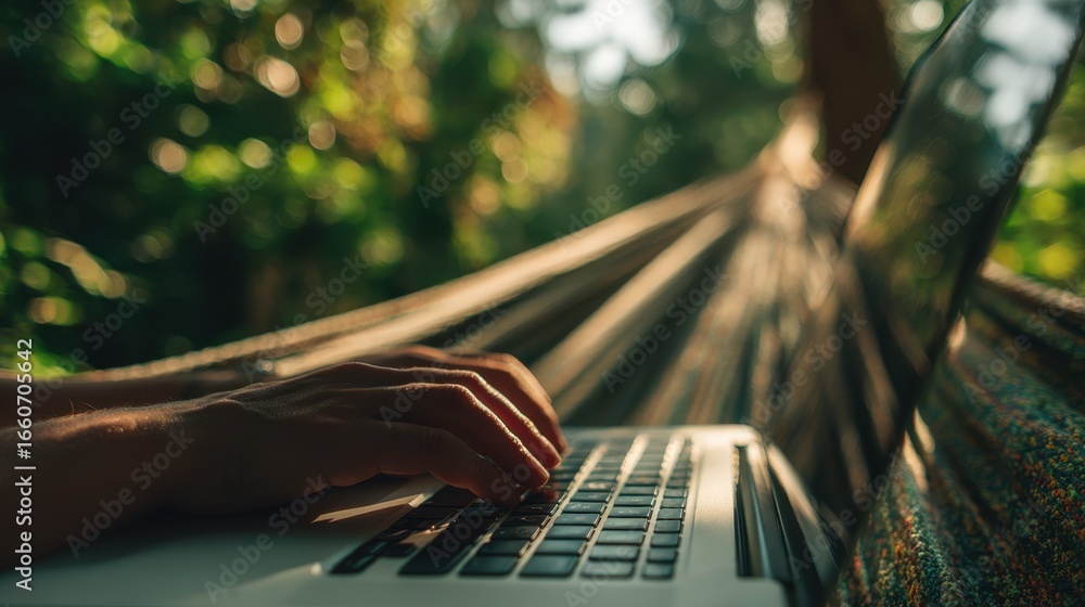 Poster digital nomad focused on a laptop keyboard in a hammock background softly blurred with greenery conv