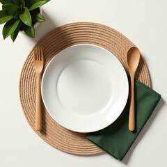 Eco-friendly table arrangement with bamboo cutlery on ceramic plate and green napkin