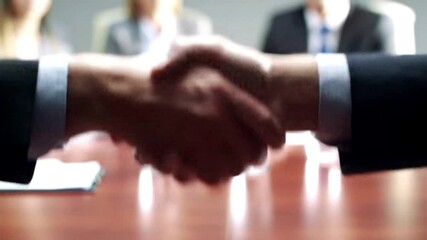 Business deal with handshake at office meeting signifies success agreement