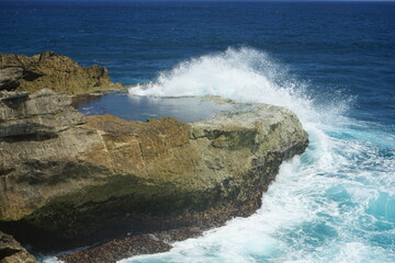 waves crashing on rocks
