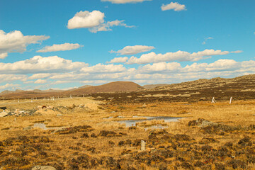 Fototapeta premium Haizi Mountain, Sichuan Vast plateau strewn with rocks under a blue sky