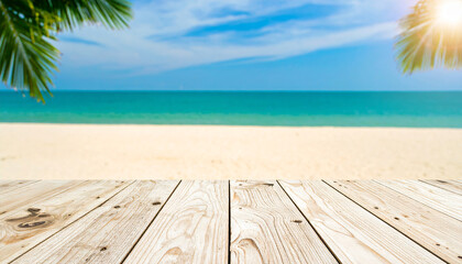 Fototapeta premium Empty wooden table on a beautiful tropical beach with a wooden floor under the summer sun, overlooking the blue sea and sky horizon