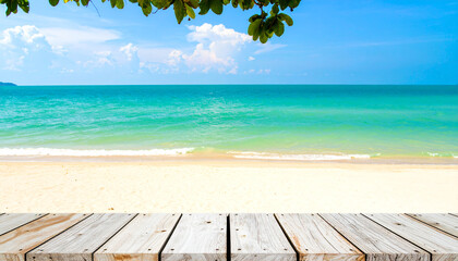 Empty wooden table on a beautiful tropical beach with a wooden floor under the summer sun, overlooking the blue sea and sky horizon