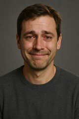 Fototapeta premium Man's subtle, yet sincere, smile conveys happiness, joy, and emotional connection