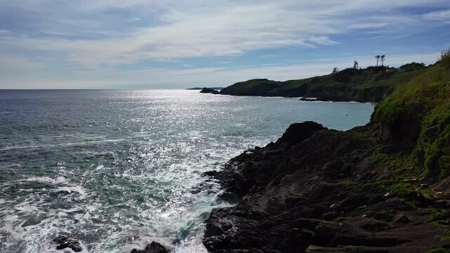 Rocky coastlines with sunlight reflecting on waver sea side near Phare du Petit Minou, Finist&egrave;re, France.