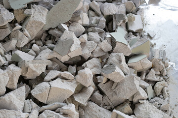 Broken concrete, Piles of lightweight construction bricks after house demolition