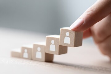 Professional Workforce Development Concept with Hand Stacking Wooden Blocks Representing Career Progression and Skill Advancement for Business Marketing