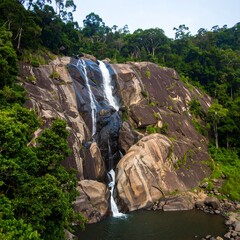 Majestic waterfall cascading into a tranquil pool, surrounded by lush green forest