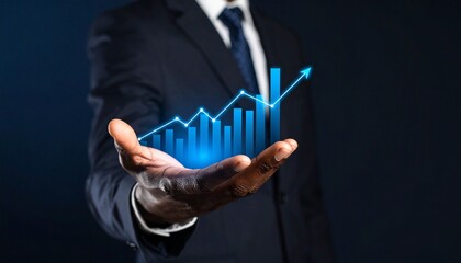 A man in a suit has one hand outstretched against a dark background, with a glowing, rising blue line chart on his hand
