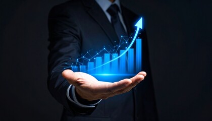 A man in a suit has one hand outstretched against a dark background, with a glowing, rising blue line chart on his hand