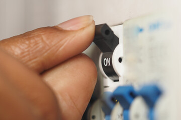 Hand adjusting electrical switch in home setting