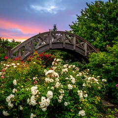 Rustic wooden arch bridge over vibrant rose garden at sunset