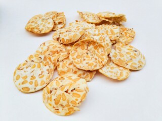 High angle view of tempeh chips on a white background. 